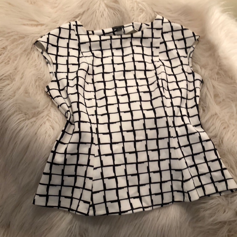Black and cream slightly peplum top